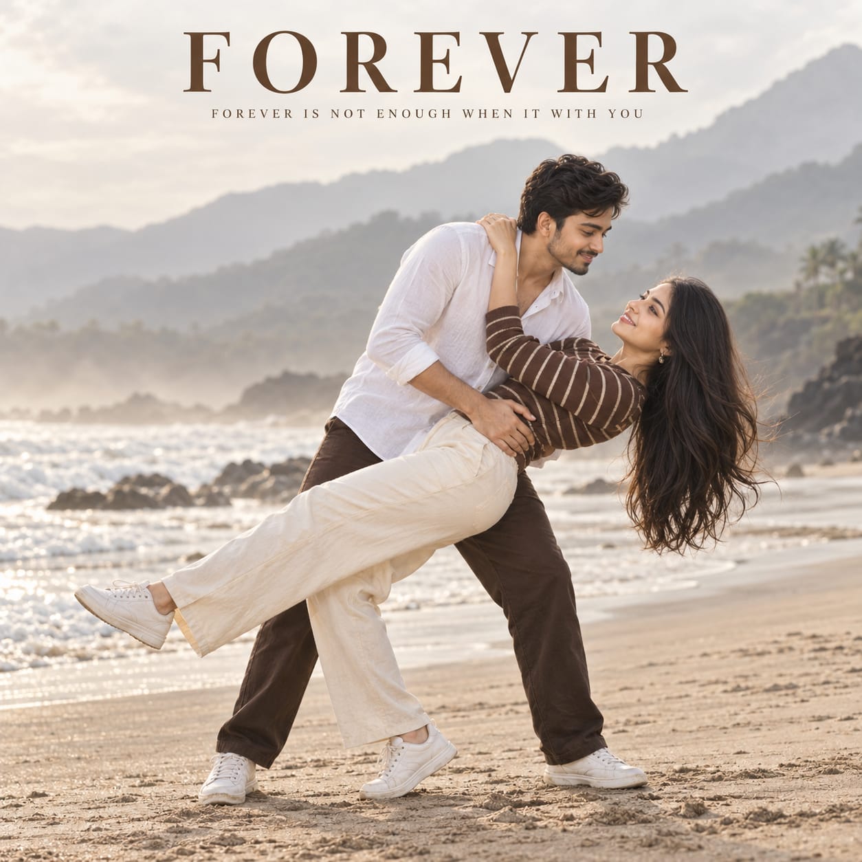 Romantic young couple posing on a misty sandy beach, with the man dipping the woman backward against distant mountains in a dreamy cinematic portrait.
